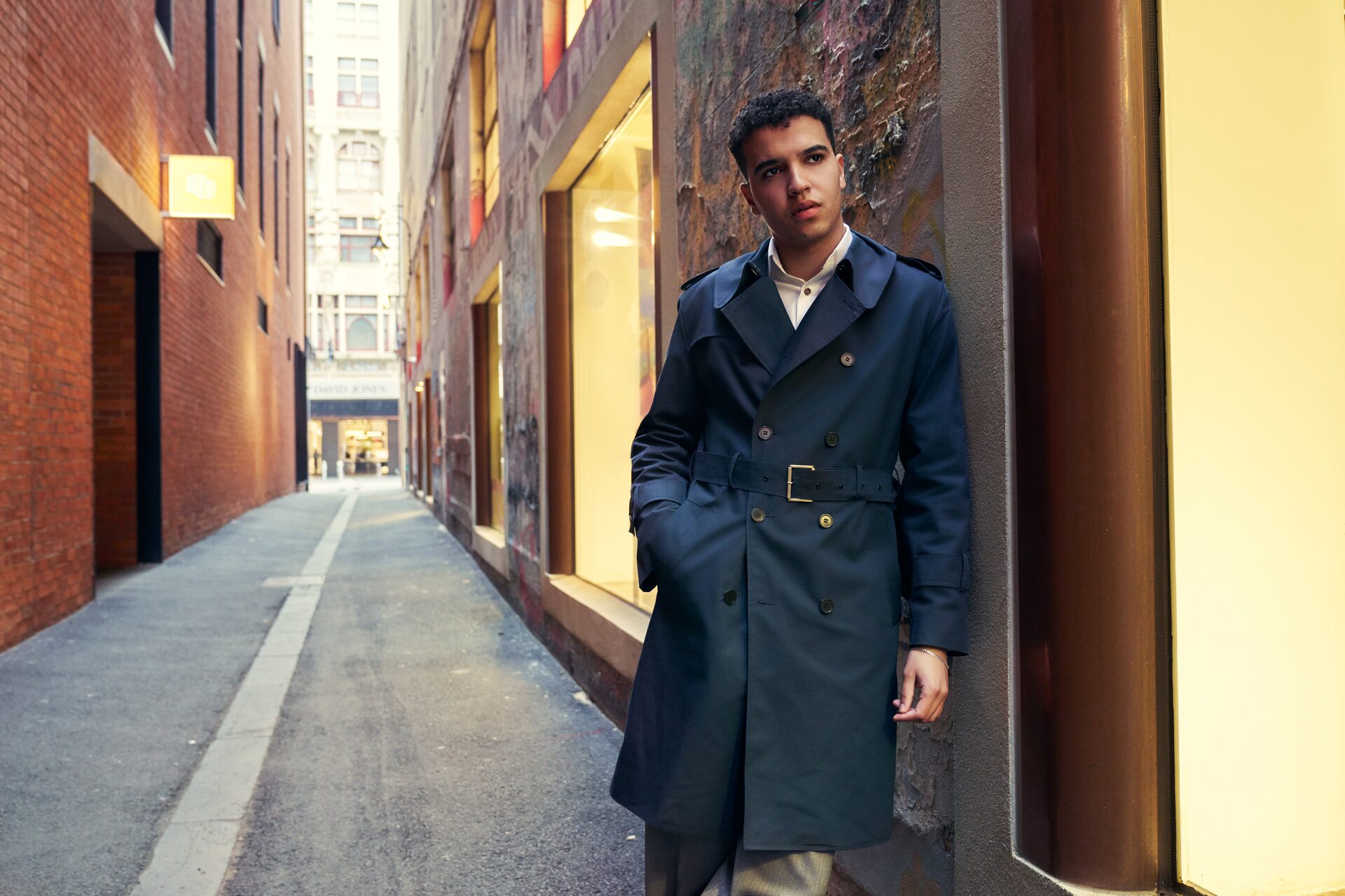 MR. CUFF bespoke tailoring — man in a navy trench coat in a Melbourne laneway