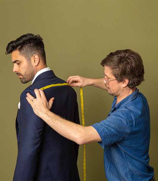 Jarrad Cuff measuring male model, making a bespoke tailor made suit in Melbourne